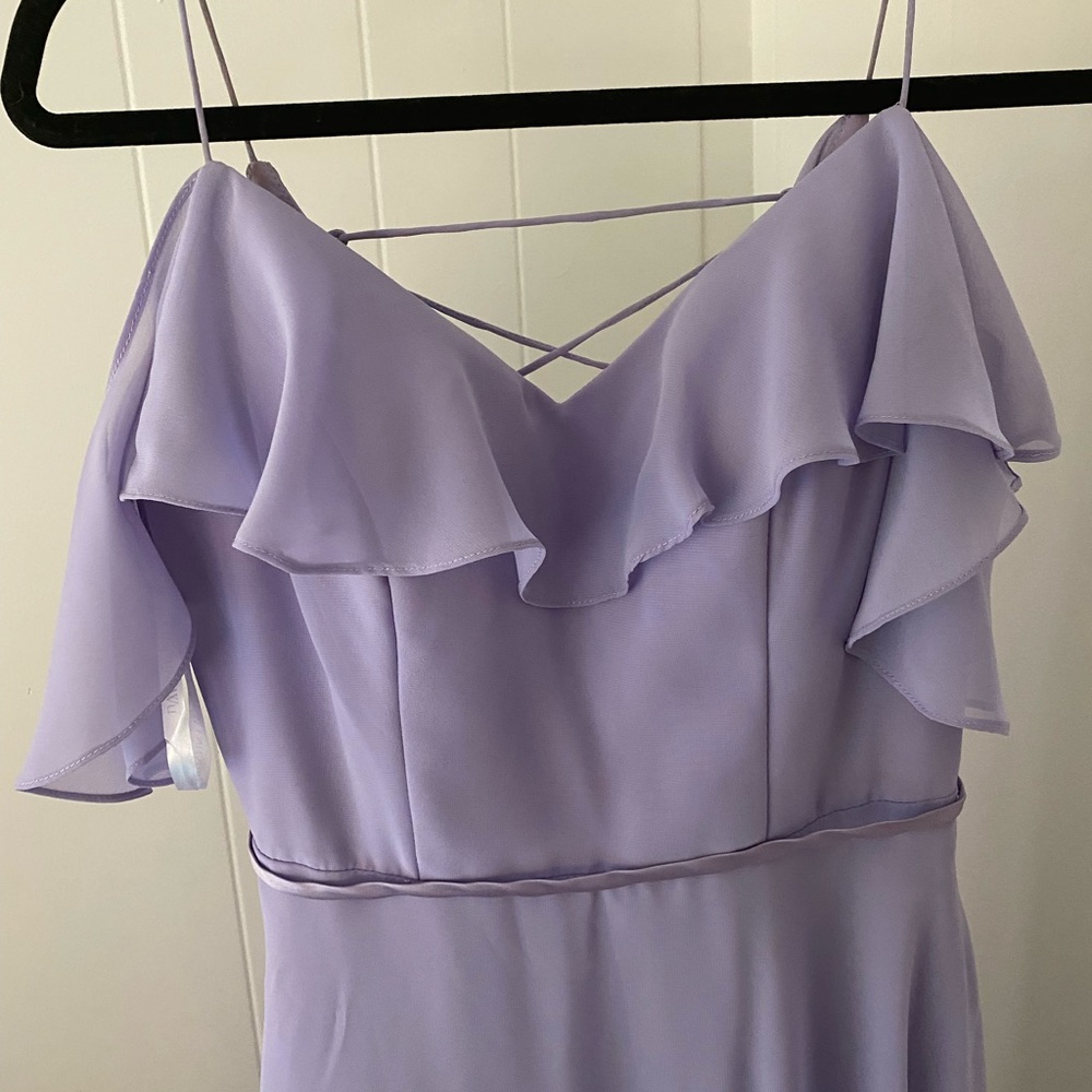 Lilac purple long bridesmaids dress with ruffle details and sleeves